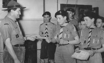 Richard Robinson and Michael Camp receiving their 1st Class Scout Badges, 1960